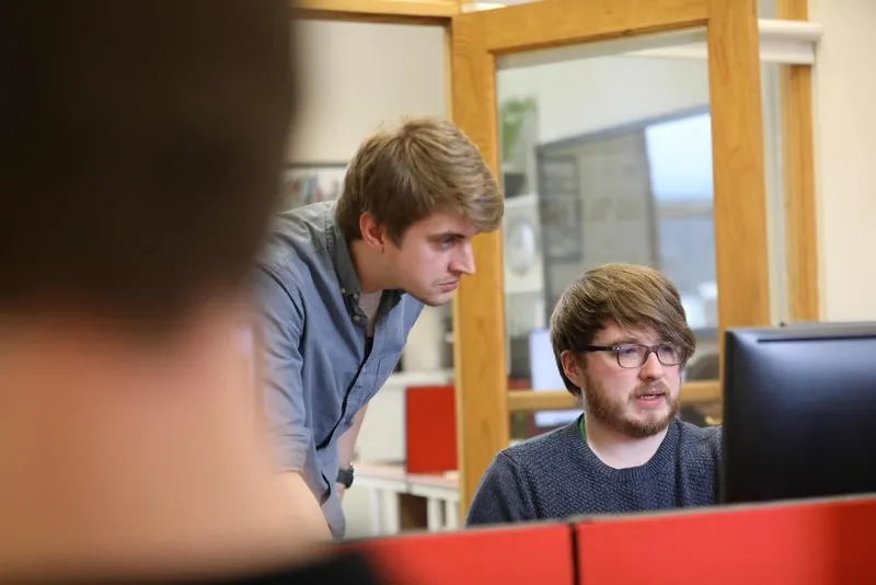 Aetopia team working with a client